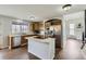 Well-equipped kitchen with stainless steel appliances, an island cooktop, and wood cabinets at 21562 Omaha Ave, Parker, CO 80138