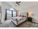 Well-lit main bedroom with vaulted ceilings and a large window bringing in natural light at 21562 Omaha Ave, Parker, CO 80138