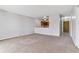 Inviting living room featuring neutral carpet and a cutout view into the adjacent kitchen at 9155 E Center Ave # 3C, Denver, CO 80247