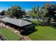 Aerial view of the community pool and lawn area with a shaded pavilion, barbecue, and outdoor seating at 9155 E Center Ave # 3C, Denver, CO 80247