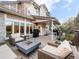 Outdoor deck with fire pit, comfortable seating, and backyard views at 62 N Ranch Rd, Littleton, CO 80127