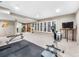 Finished basement home gym with large windows and plenty of workout equipment at 62 N Ranch Rd, Littleton, CO 80127