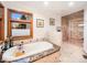 Elegant bathroom featuring a marble-trimmed soaking tub and separate glass-enclosed shower at 62 N Ranch Rd, Littleton, CO 80127