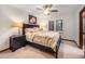 Relaxing bedroom with a queen bed, nightstands, and a large window with shutters at 62 N Ranch Rd, Littleton, CO 80127