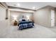Finished basement bedroom features neutral colors and dual bedside tables with lamps at 62 N Ranch Rd, Littleton, CO 80127