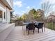 Outdoor deck boasts space for dining and entertaining with wrought iron railing and wooded views at 62 N Ranch Rd, Littleton, CO 80127