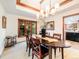 Elegant dining room with wood trim, natural light, and a decorative chandelier at 62 N Ranch Rd, Littleton, CO 80127