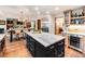 Spacious kitchen with center island, stainless steel appliances, open to dining area and fireplace at 62 N Ranch Rd, Littleton, CO 80127