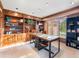 The home office with a built-in bookcase and a work space provides storage and functionality at 62 N Ranch Rd, Littleton, CO 80127