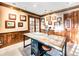 The office features wood accents, offering a perfect setting for work or study with ample light at 62 N Ranch Rd, Littleton, CO 80127