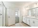 Bright bathroom with double vanity, glass enclosed shower, and neutral color palette at 9293 Biscay St, Commerce City, CO 80022