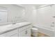 Well-lit bathroom featuring a vanity with a sink and shower with bathtub at 9293 Biscay St, Commerce City, CO 80022