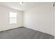 Bedroom with neutral colored carpet, one window allowing natural light at 9293 Biscay St, Commerce City, CO 80022