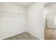 Walk-in closet with carpet flooring and wire shelving for optimized storage at 9293 Biscay St, Commerce City, CO 80022