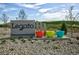 Community sign surrounded by landscaping and colorful planters at 9293 Biscay St, Commerce City, CO 80022