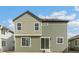 Exterior of the house, featuring a sliding glass door leading to the backyard at 9293 Biscay St, Commerce City, CO 80022