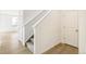 Inviting hallway with wood-look floors and staircase leading to upper level at 9293 Biscay St, Commerce City, CO 80022