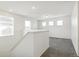 Light-filled loft with neutral carpet is perfect for a home office or play area at 9293 Biscay St, Commerce City, CO 80022