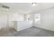 Upstairs loft boasts neutral carpet and sun-drenched windows offering community views at 9293 Biscay St, Commerce City, CO 80022