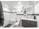 Modern bathroom featuring a tiled shower with a glass door, toilet and vanity at 915 N Kearney St, Denver, CO 80220