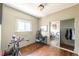 Bedroom featuring hardwood floors, a work area, and a closet for storage at 915 N Kearney St, Denver, CO 80220