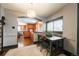 Cozy dining room with stylish lighting, a view into the kitchen, and a dark painted ceiling at 915 N Kearney St, Denver, CO 80220