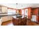 Beautiful kitchen showcasing an island, modern lighting, granite countertops, and a wine rack at 915 N Kearney St, Denver, CO 80220