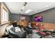 Finished garage converted to living room featuring gray accent walls and comfortable seating at 915 N Kearney St, Denver, CO 80220