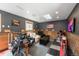 Garage converted to a living room with stylish decor and gray accent wall with wood trim at 915 N Kearney St, Denver, CO 80220