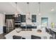 Modern kitchen featuring stainless steel appliances, sleek cabinetry, and an island at 15252 W 69Th Pl, Arvada, CO 80007