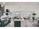 Bright, open-concept kitchen with an island, stainless steel appliances, and stylish finishes at 15252 W 69Th Pl, Arvada, CO 80007