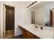 Bathroom featuring a vanity with a large mirror and a shower at 6240 Everett Ct # B, Arvada, CO 80004