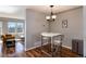 Dining area next to the living room with bright light from windows and hardwood flooring at 6240 Everett Ct # B, Arvada, CO 80004