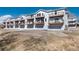 View of an exterior of townhomes with covered parking and balconies at 6240 Everett Ct # B, Arvada, CO 80004