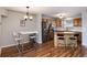 Kitchen view with stainless steel appliances, wooden cabinets, and an island with bar seating at 6240 Everett Ct # B, Arvada, CO 80004