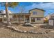 The house with a spacious backyard, deck, and landscaping, great for outdoor enjoyment and entertaining at 805 Northridge Rd, Highlands Ranch, CO 80126