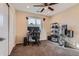 Bedroom with carpet flooring, ceiling fan, and a large window, set up as a home office at 805 Northridge Rd, Highlands Ranch, CO 80126