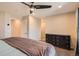 Neutral bedroom featuring a ceiling fan, large dresser and a doorway leading to other rooms at 805 Northridge Rd, Highlands Ranch, CO 80126
