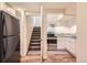 Kitchen with stainless steel appliances and white cabinets at 805 Northridge Rd, Highlands Ranch, CO 80126