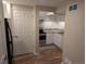 Well-lit kitchen with white cabinets, stainless steel appliances, and granite countertops, offering a clean and modern design at 805 Northridge Rd, Highlands Ranch, CO 80126