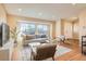Bright living room features hardwood floors, large windows, and neutral tones at 805 Northridge Rd, Highlands Ranch, CO 80126