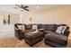 Spacious living room featuring a large sectional sofa with comfortable seating and neutral colored walls at 805 Northridge Rd, Highlands Ranch, CO 80126