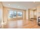 Spacious living room showcases hardwood floors and ample natural light from large front windows at 805 Northridge Rd, Highlands Ranch, CO 80126