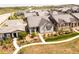 Aerial view showcases this home's attractive exterior and landscaping in a desirable neighborhood at 997 Brocade Dr, Highlands Ranch, CO 80126