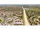 An aerial view showcases the neighborhood's layout, proximity to roadways, and housing density at 997 Brocade Dr, Highlands Ranch, CO 80126
