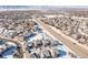 Wide aerial view of home and neighborhood, showcasing location and landscape at 997 Brocade Dr, Highlands Ranch, CO 80126