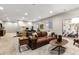 Spacious basement rec area with leather couch at 997 Brocade Dr, Highlands Ranch, CO 80126