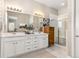 Modern bathroom with double vanity and a large walk-in shower at 997 Brocade Dr, Highlands Ranch, CO 80126