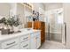 Elegant bathroom featuring a double vanity and a shower at 997 Brocade Dr, Highlands Ranch, CO 80126