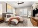Warm and inviting bedroom featuring a large bed, neutral decor, and ample natural light at 997 Brocade Dr, Highlands Ranch, CO 80126